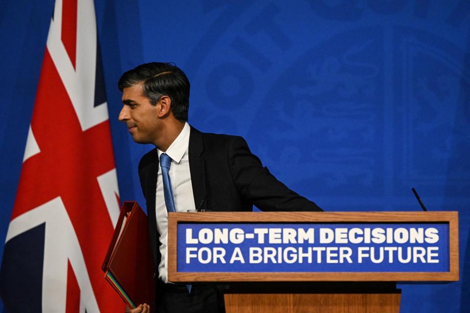 Britain's Prime Minister Rishi Sunak leaves the stage after delivers a speech during a press conference on the net zero target, at the Downing Street Briefing Room, in central London, on September 20, 2023. The UK looked set to backtrack on policies aimed at achieving net zero emissions by 2050 with Prime Minister Rishi Sunak expected to water down some of the government's green commitments. The move comes amid growing concern over the potential financial cost of the government's policies to achieve net zero carbon emissions by mid-century. (Photo by JUSTIN TALLIS / POOL / AFP) (Photo by JUSTIN TALLIS/POOL/AFP via Getty Images)
