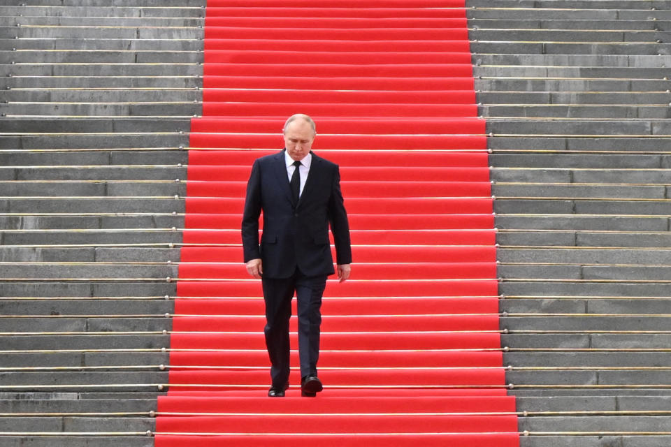 TOPSHOT - Russian President Vladimir Putin walks down the steps to address troops from the defence ministry, National Guard, FSB security service and interior ministry gathered on the Sobornaya (Cathedral) Square from the porch of the the Palace of the Facets on the grounds of the Kremlin in central Moscow on June 27, 2023. (Photo by Sergei GUNEYEV / SPUTNIK / AFP) (Photo by SERGEI GUNEYEV/SPUTNIK/AFP via Getty Images)