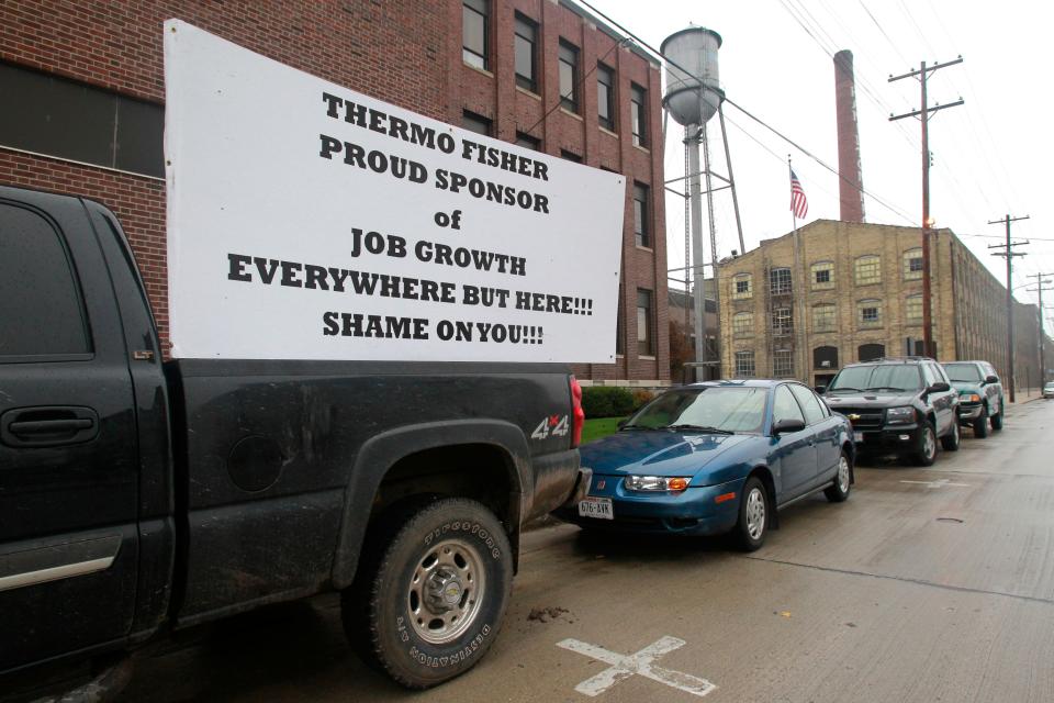 A truck is parked outside Thermo Fisher Scientific is shown in 2011 in Two Rivers, Wis. The company moved its manufacturing to Texas and Mexico