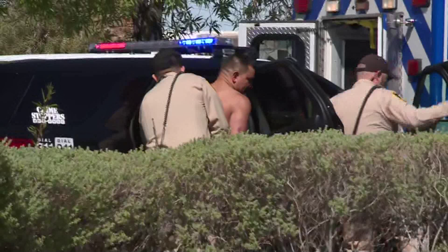 Las Vegas police take man into custody as they investigate shooting near Flamingo Road and 215 on Wednesday, May 1, 2024 (KLAS)