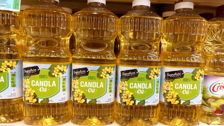 bottles of canola oil in grocery store