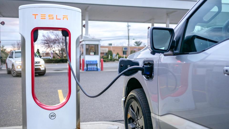 Ford F150 Lightning charging at Tesla station