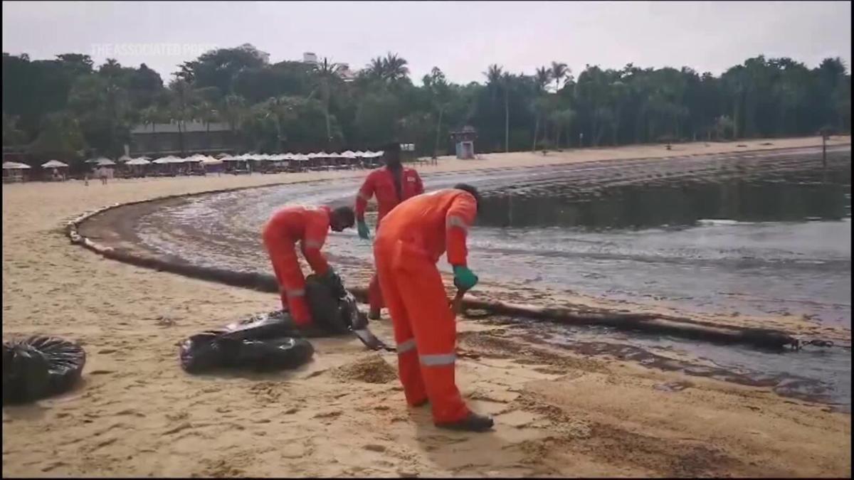 Singapore rushes to clean-up oil slick after boat hits fuel ship