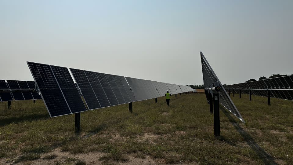 Solar panels sit on acres of old farmland in Becker, Minnesota — part of Xcel Energy's massive Sherco solar project. - Julian Quinones, CNN