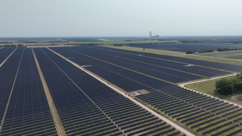 Outside the plant, solar panels span acres of farmland. Sherco — a fossil fuel behemoth — looks small in comparison. - Julian Quinones, CNN