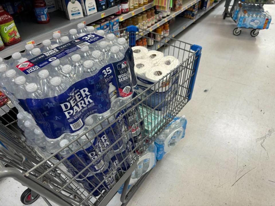 Mohamed Abbas loaded his cart full of toilet paper and water Wednesday at a Myrtle Beach Walmart. Some grocery items are becoming low because of Hurricane Helene and panic buying. Oct. 2, 2024