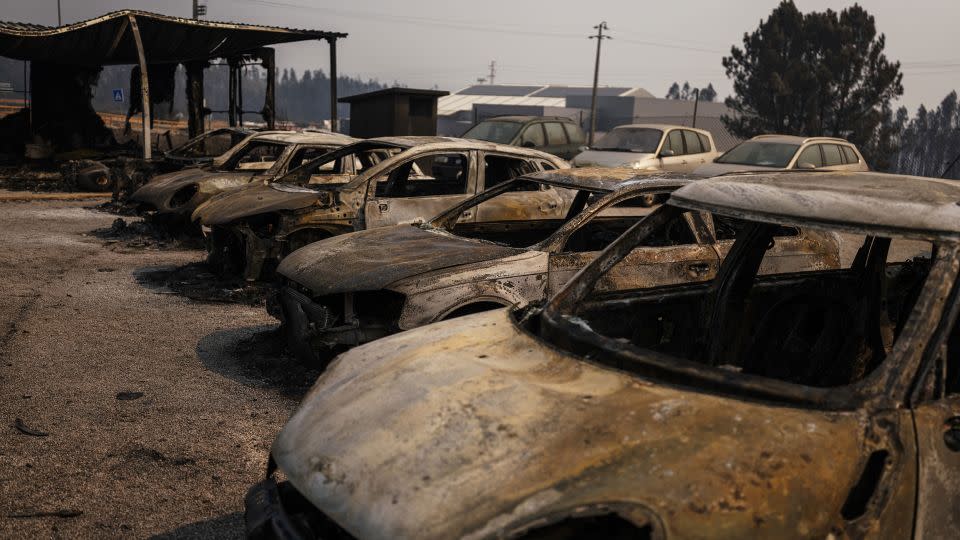 Cars destroyed by a wildfire on a dealership forecourt in Albergaria-a-velha, on September 18. - Jose Sarmento Matos/Bloomberg/Getty Images