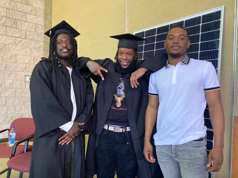 Chris Washington, Shaquan Jones, and Caprice Gullens at the graduation of Renewing Sovereignty Project's first graduation ceremony.