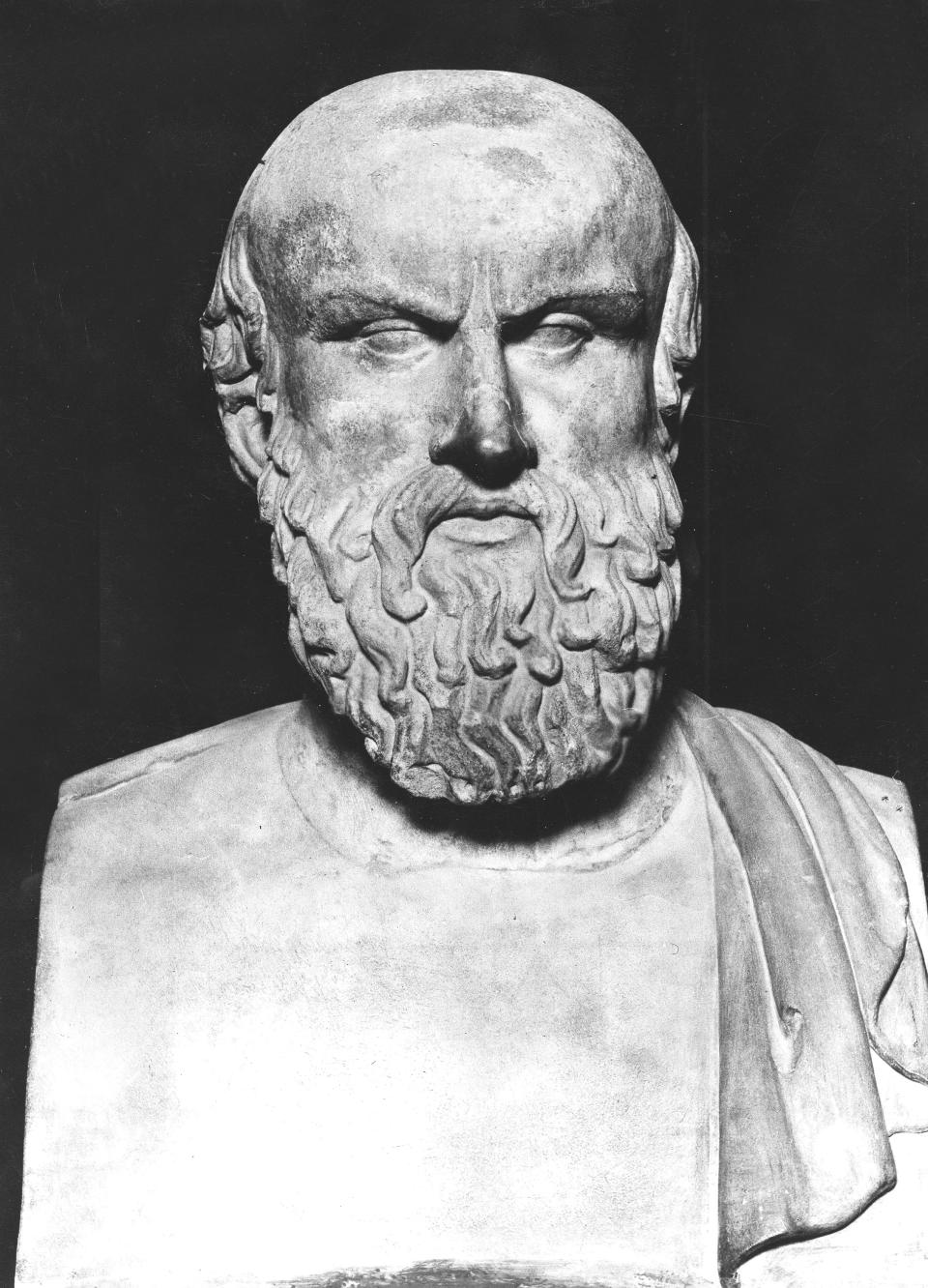 Bust of an ancient figure with a beard and detailed facial features