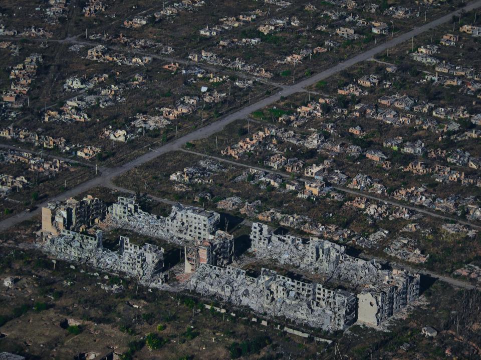 An aerial view of the city of Bakhmut with all buildings destroyed, leaving rows of rubble.