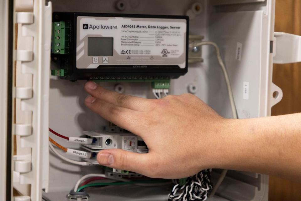 Adham Shanab, metering application engineer, shows off a power box installed with Apolloware in the Bandera Electric Cooperative warehouse in Boerne, Texas on January 30, 2025.