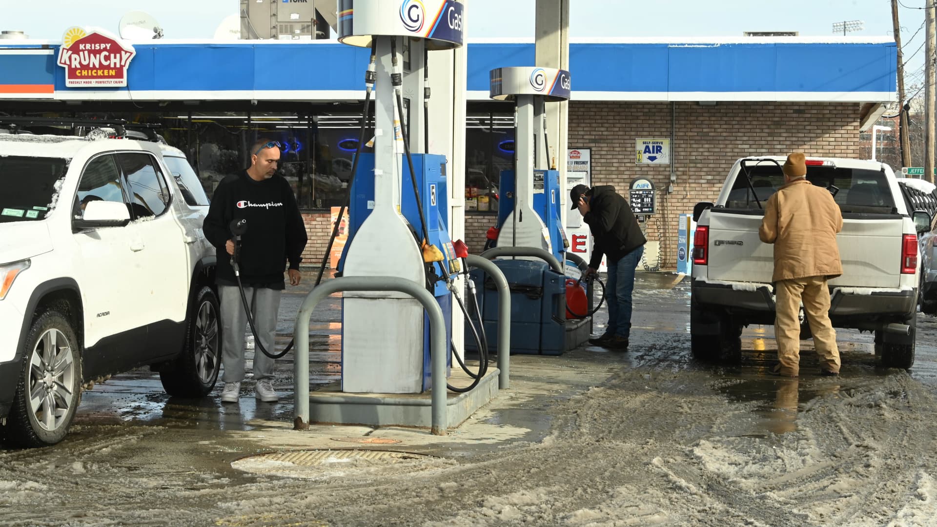 Gas prices fall to four-year lows as millions embark on holiday road trips