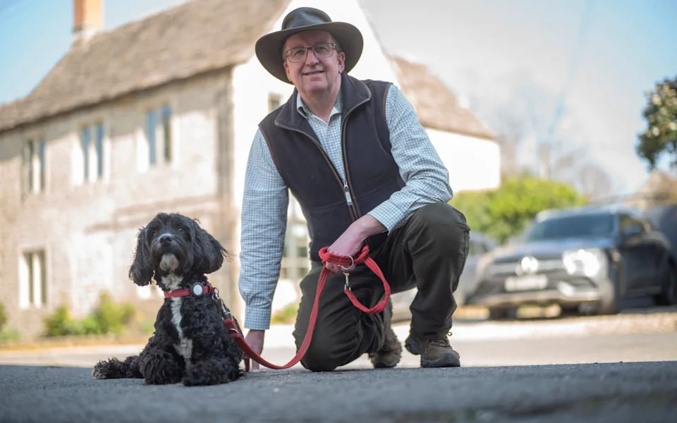 Portrait of resident Roger Baskerville with Ginny his springerpoo in Marston Meysey, Wiltshire, March 19, 2026.