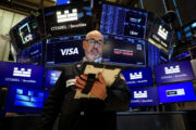 Stocks flat as traders digest Fed comments, oil falls