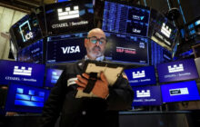 Stocks flat as traders digest Fed comments, oil falls
