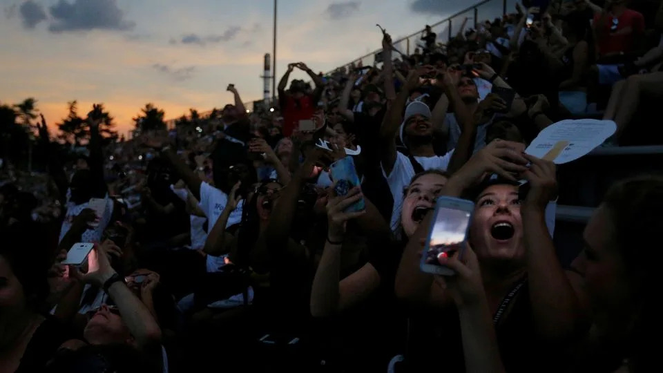 People react to the total eclipse at Southern Illinois University in Carbondale, Illinois, on August 21, 2017. - Brian Snyder/Reuters