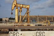 Oil prices little changed as traders weigh strong Mideast exports against Gulf tensions